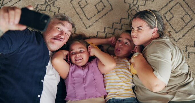Home, parents and children with silly for selfie, social media memory or bonding together on carpet. House, mother and father with kids for photography, family picture or relationship with funny face