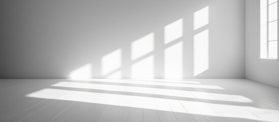 Fototapeta premium Minimalist interior room design with natural light and shadows creating an empty space suitable for text placement and decoration ideas