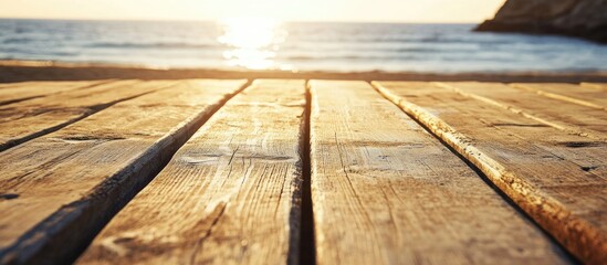 Sunset over a weathered boardwalk by the ocean showcasing wooden planks with natural textures and...