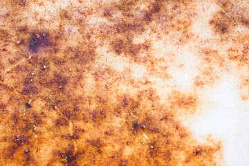 Corroded metal background. Rusted grey painted metal wall. Rusty metal background with streaks of rust. Rust stains. The metal surface rusted spots.