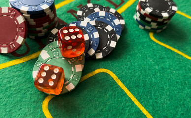 Rolling red dice on a casino table with chips