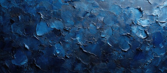 Textured closeup of a painted blue wall featuring rich hues and intricate brush strokes for artistic background or design elements.