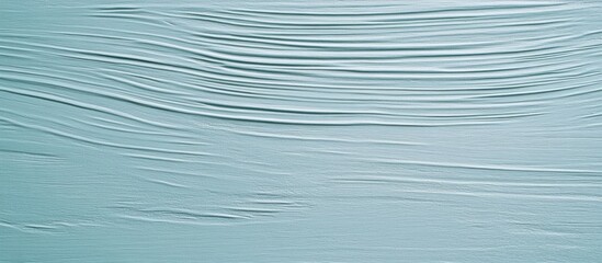 Plywood siding with a textured surface painted in pale blue for a modern aesthetic background or architectural design element