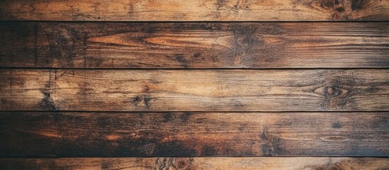 Naklejka premium Rustic wooden board background showcasing rich textures and warm tones for a vintage or natural aesthetic design.