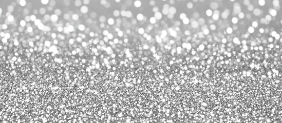 Elegant white and silver glitter lights background for festive and celebratory themes, ideal for design projects and party invitations.