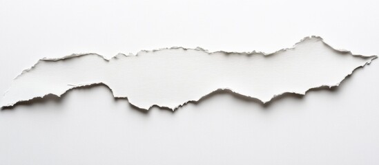 Torn edge of white paper isolated on a clean background for design and creative purposes