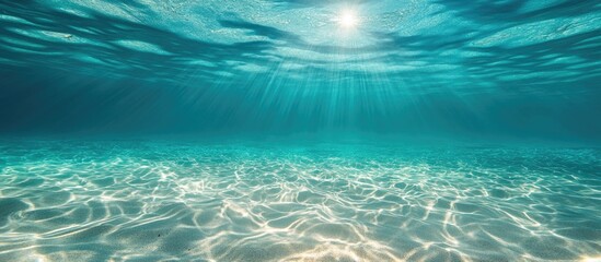 Breathtaking underwater scene showcasing light rays filtering through clear sea water with captivating jellyfish drifting gracefully.