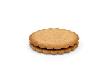 Sandwich cookie with chocolate cream and hazelnuts isolated on white background.
