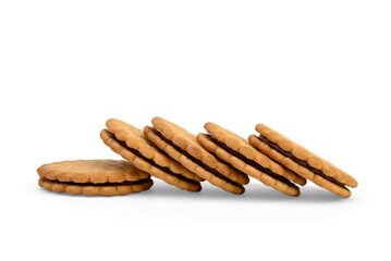 Sandwich cookie with chocolate cream and hazelnuts isolated on white background.