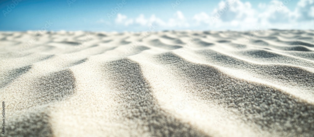 Poster Gentle sand dunes with textured sandy surface under a clear sky and soft clouds creating a serene desert landscape background.