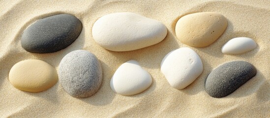 Sands and Various Shaped Pebbles Beautifully Arranged on Beach Shoreline for Natural Texture and Background