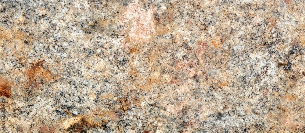 Poster textured granite rock surface with warm tones and natural patterns for backgrounds or geological the