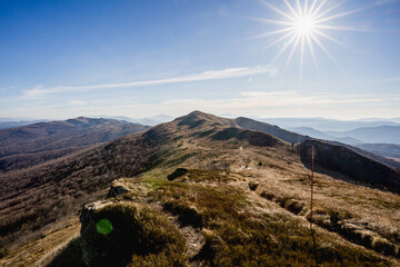 Scenic autumn landscapes from a trekking loop in Bieszczady, featuring views from Tarnica, Halicz, Rozsypaniec, Bukowe Berdo, Połonina Wetlińska, and the Ukrainian Bieszczady under a clear blue sky