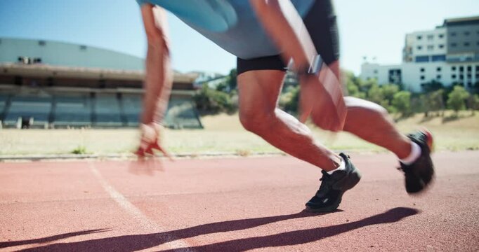 Man, ready and runner at start line on track with smart watch, race and launch with speed for sport. Person, athlete and sprint training with fitness for contest, competition and workout in Jamaica