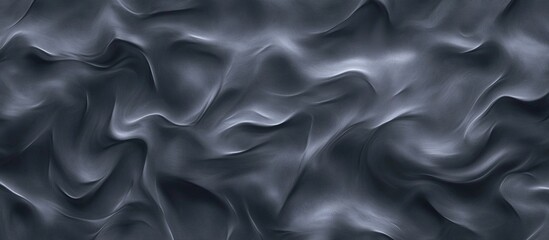 Fototapeta premium Smooth flowing gray fabric texture with wave patterns creating an elegant and abstract background design for artistic applications.