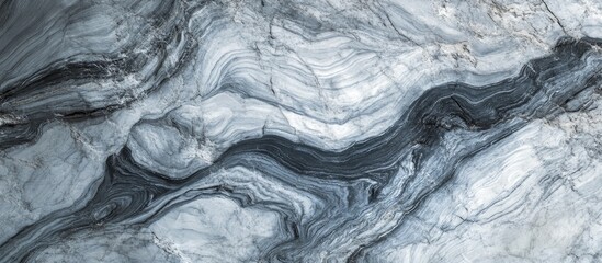 Elegant gray marble texture with flowing patterns for a sophisticated background or abstract design element.