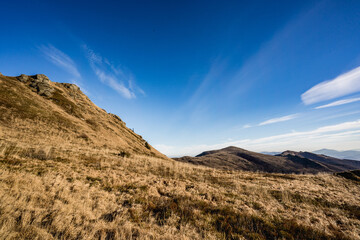 Scenic autumn landscapes from a trekking loop in Bieszczady, featuring views from Tarnica, Halicz, Rozsypaniec, Bukowe Berdo, Połonina Wetlińska, and the Ukrainian Bieszczady under a clear blue sky