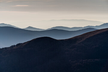 Fototapeta premium Scenic autumn landscapes from a trekking loop in Bieszczady, featuring views from Tarnica, Halicz, Rozsypaniec, Bukowe Berdo, Połonina Wetlińska, and the Ukrainian Bieszczady under a clear blue sky