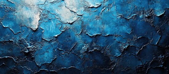 Naklejka premium Bright blue textured concrete wall background with intricate pattern ideal for artistic and design projects.