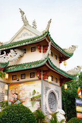 Fototapeta premium Traditional Vietnamese temple with dragon roof and colorful mural