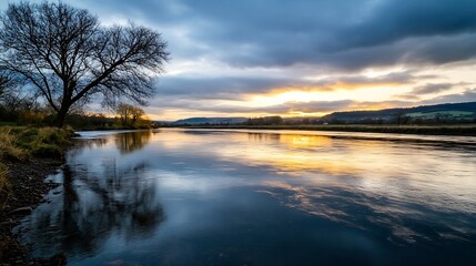 Fototapeta premium Sunset reflecting off a tranquil river with trees lining its banks creating a soft atmosphere : Generative AI
