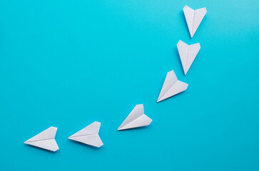 View of origami white paper airplane charting the course with the journey of a great leader