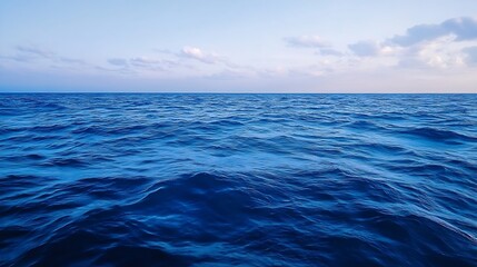 Obraz premium Vast Ocean View with Gentle Waves Under a Clear Blue Sky Captured in Tranquil Seascape : Generative AI