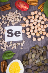 Healthy food containing selenium, fiber and other vitamins and minerals. Black wooden background