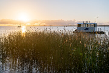 Lake Cootharaba dawn sunrise, peaceful landscape, boats houseboats, tourism travel visit