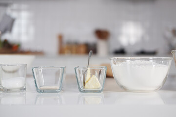 Homemade fresh wheat flour for making desserts and cheese in a bowl on white counter preparing for baking  buns bread and bakery cake in kitchen