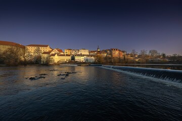Royal city of Písek. Evening photo of the city. Bridge over the Otava River. Sunset. Quiet evening...
