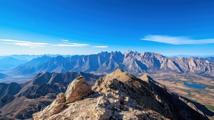 Obraz premium Majestic jagged mountains under clear skies wide-angle view nature landscape frigid topography sharp shadows