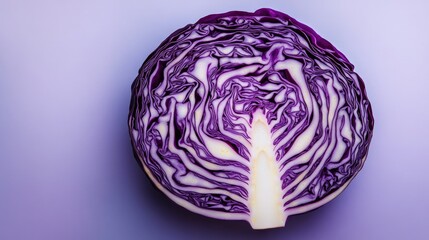 Fototapeta premium A visually striking composition of a cross-sectioned purple cabbage, highlighting its natural complexity.
