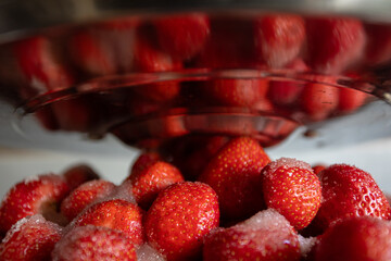 Delicious Fresh Strawberries Beautifully Presented in a Chilled Display for Sale and Enjoyment