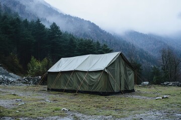 Military Shelter: Tactical Tent for Army Personnel in Grey and Green Amidst Mountainous Terrain