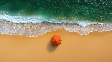 Obraz premium Orange beach umbrella on sandy shore, ocean waves, aerial view, summer vacation concept