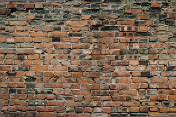 brick wall made of old brown bricks close up
