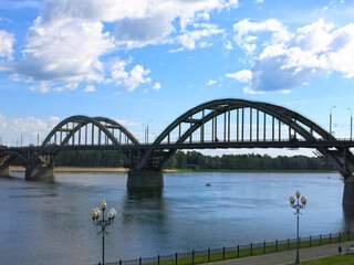 Fototapeta premium Automobile and pedestrian bridge over the Volga River in the city of Rybinsk, Yaroslavl region