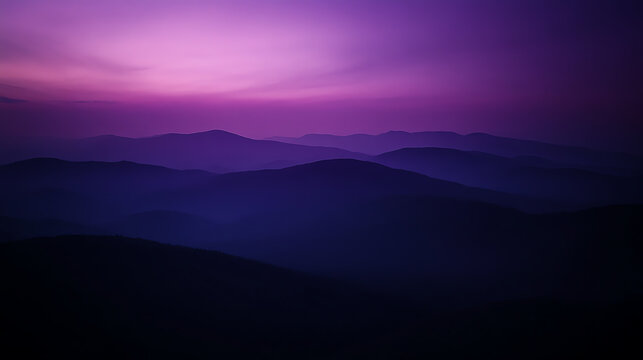 A stunning twilight landscape featuring rolling hills bathed in shades of purple and blue, creating a serene and calming atmosphere perfect for relaxation or contemplation.