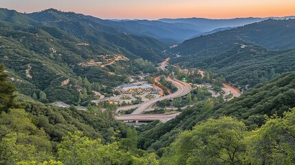 Highway winding through sunset valley