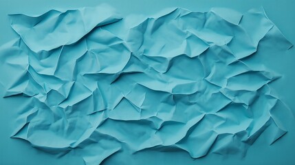 Obraz premium An abstract view of crumpled blue paper creates a textured background, perfect for design projects, presentations, or artistic expressions that require a unique visual element.