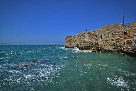 Old walls of ancient Akko and the sea.
