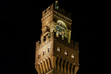 A nighttime view of the bell tower of the palazzo Vecchio of Florence