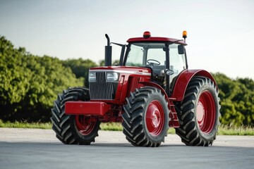 Obraz premium A red tractor parked in an outdoor parking lot