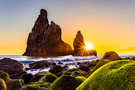 lava rocks in the Atlantic Ocean, island towers in Ribeira da Janela, Madeira Island, Portugal. The rock formations are of volcanic origin in the Atlantic Ocean at sunrise