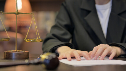 Close up of Female Judge Frustrated Female Lawyer Trying to Write