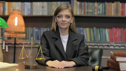 Approval Gesture by Female Lawyer in Office