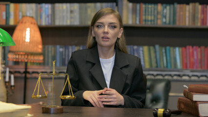 Female Lawyer Doing Video Chat in Office