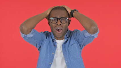 Fototapeta premium Casual African Man Reacting to Failure on Red Background, Portrait