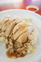 Steamed rice topped with boiled chicken at Singapore street food.